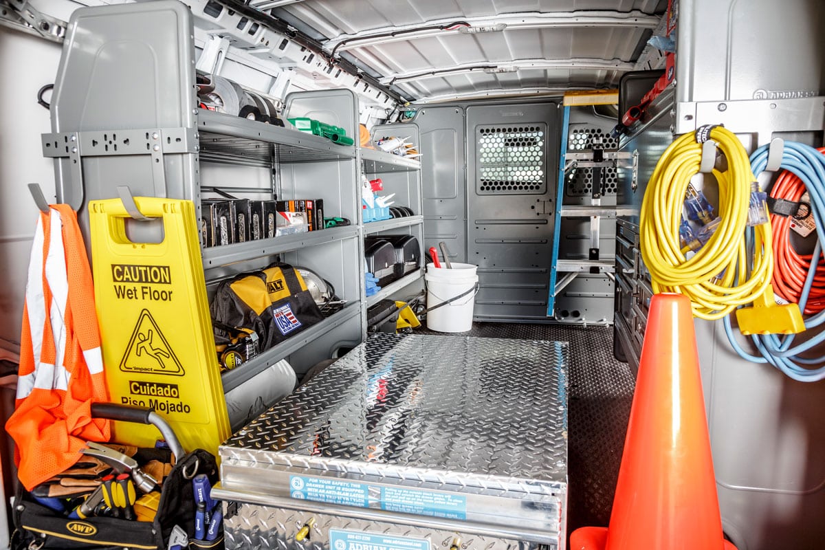 Commercial service van with organized shelving and maintenance equipment installed by for building maintenance professionals