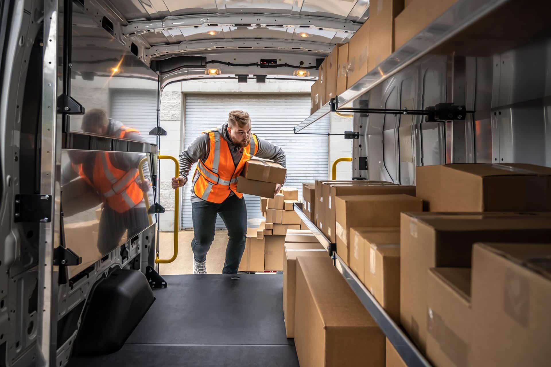 Commercial delivery van upfit with custom shelving, cargo organization, and storage systems designed for parcel and service delivery professionals