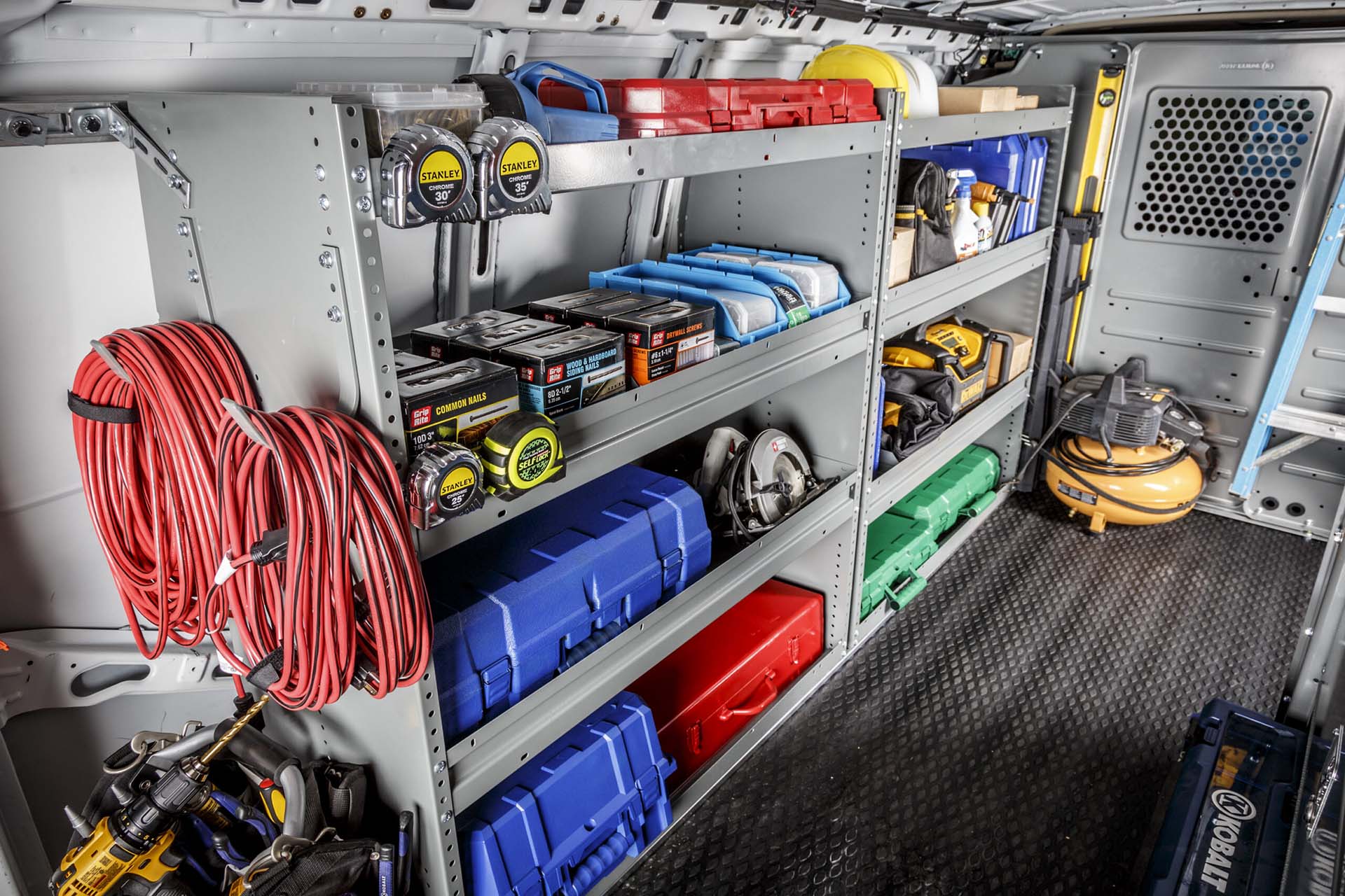 Contractor work van with ladder rack and custom shelving upfit designed for construction and trade professionals